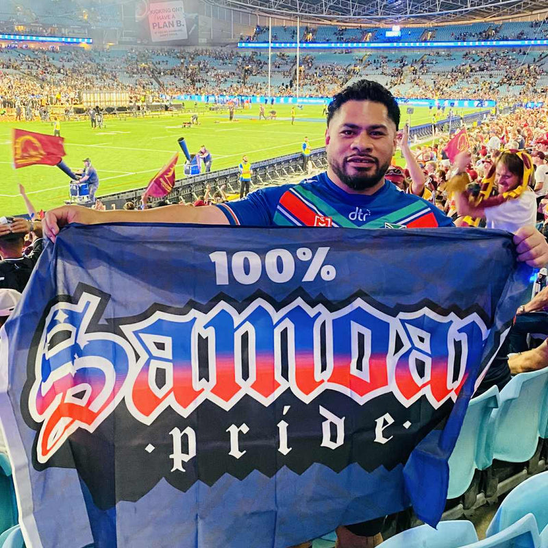 Tommy holding 100% Samoan Pride Flag